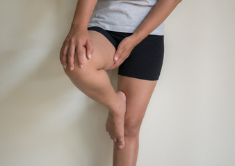 Woman injured leg with calf feeling pain .