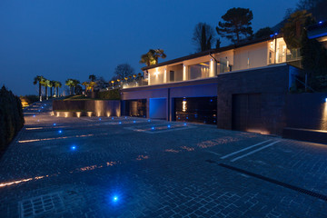 Exterior view of a modern luxury villa, nocturnal scene