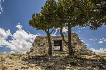 old rock house on top of a mountain 