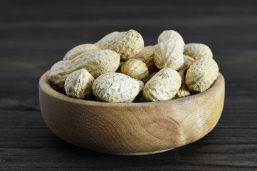 Peanuts in wooden bowl