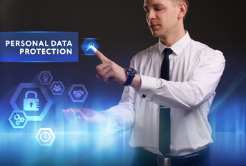 Business, Technology, Internet and network concept. Young businessman working on a virtual screen of the future and sees the inscription: Personal data protection