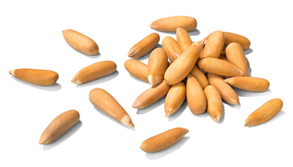 close up of raw pine nuts on white