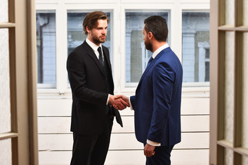 Fototapeta premium Two business partners shaking hands each other