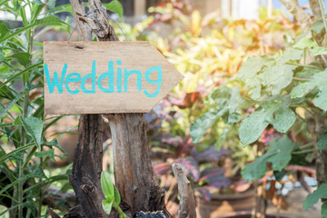 Wooden signboard with the inscription in  paint wedding. Wood hand made wedding decoration table.