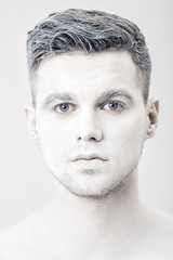 Obraz premium portrait of young man with white face paint. Professional Fashion Makeup. fantasy art makeup