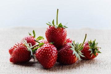 red close up strawberries with selective focus on a strawberry with many strawberries