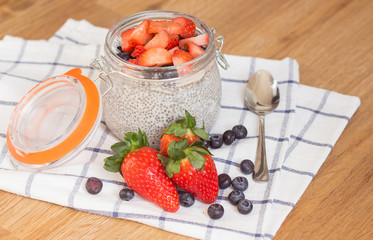 Chia seeds. A delicious healthy breakfast. Diet. Berries and pudding.