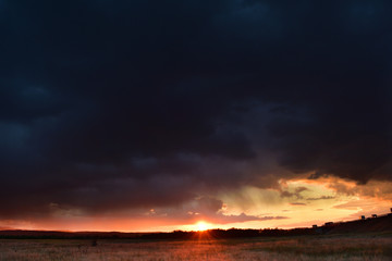 Dramatic sunset with colorful clouds in early Autumn