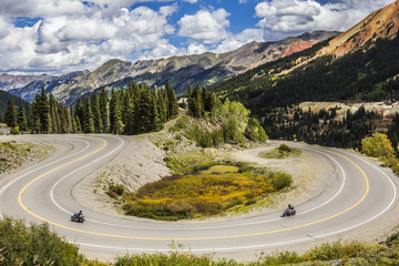 Motorcycles on a curvy mountain pass - 146256323