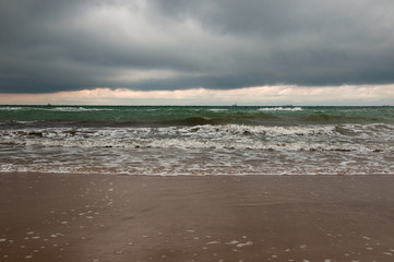 Detail of a storm in the Black Sea, Odessa, Ukraine. Sea coast storm. Water texture with foam and splashes.
