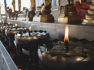 Oil lamps fire burning in the temple