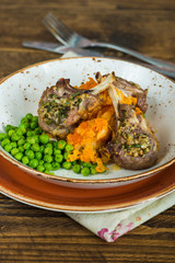 Rosemary lamb chops with carrot and parsnip mash and green peas