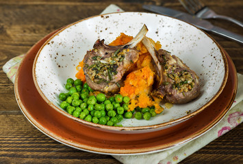 Rosemary lamb chops with carrot and parsnip mash and green peas