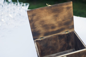 Open wooden chest stands on the table