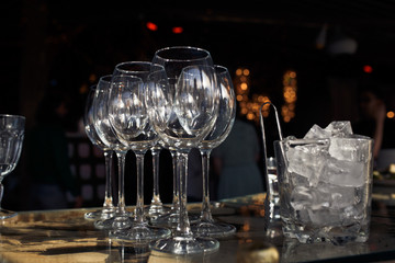 Sparkling wineglasses stand on the table