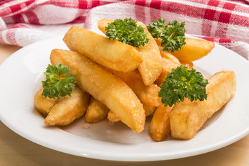 french fries with parsley on a plate