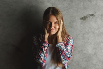 Cheerful woman on concrete background
