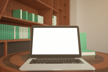 Fototapeta premium Blank white laptop in library