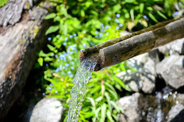 Wooden Channel For Water at a Spring in The Mountains