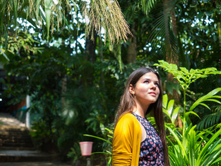 Girl walking in tropical forest