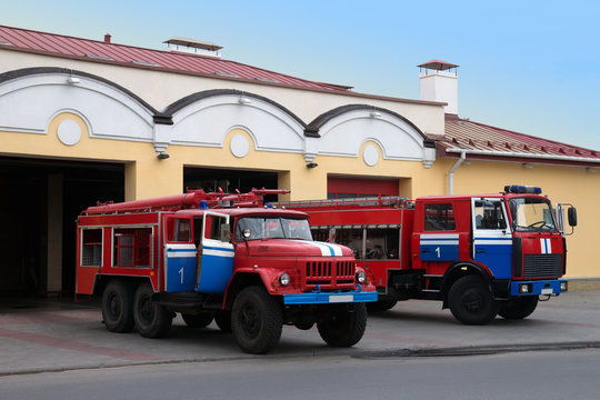 Two Fire Trucks Near Fire Station