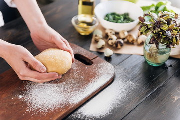 Step by step the chef prepares ravioli with ricotta cheese, yolks quail eggs and spinach with spices. The chef works with the dough