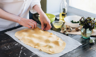 Step by step the chef prepares ravioli with ricotta cheese, yolks quail eggs and spinach with spices. The chef creates ravioli