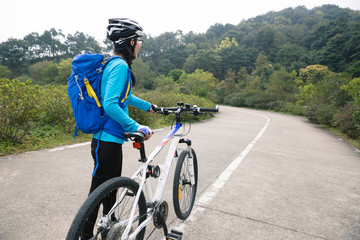 Fototapeta premium cyclist cycling mountain bike on forest trail