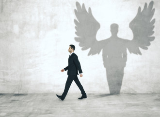 Walking man with angel shadow