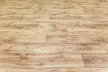 Linoleum flooring with embossed wood texture. Brown floor large area. Horizontal layout perspective.