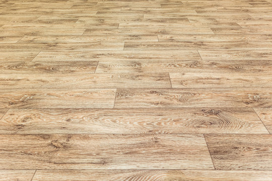 Linoleum Flooring With Embossed Wood Texture. Brown Floor Large Area. Horizontal Layout Perspective.