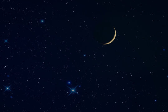 the new rising moon in the night sky and stars 