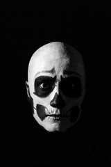 Beautiful man with creative make-up for the Halloween party