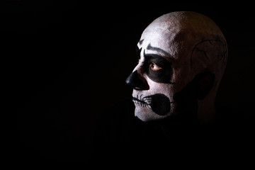 Naklejka premium Beautiful man with creative make-up for the Halloween party