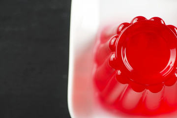 Top view of strawberry jelly on white plate.