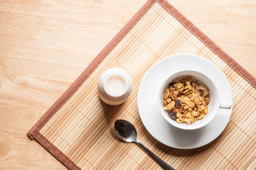 cereal and milk on wooden table breakfast in the morning