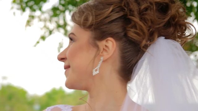 The bride jocosely looks at her husband