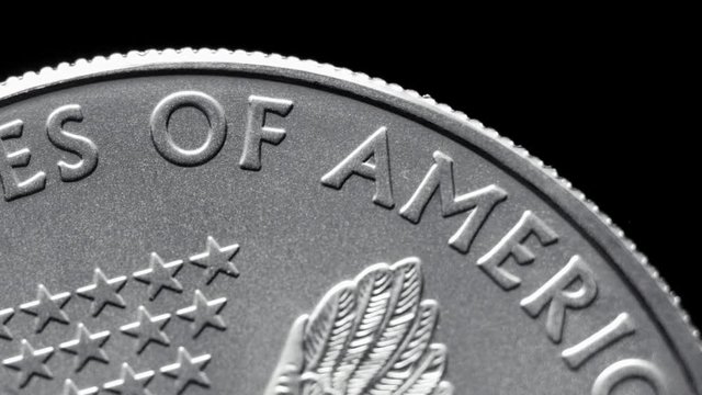 close-up shot one dollar silver eagle coin rotating
