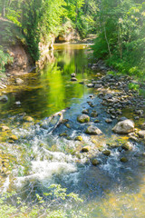 Obraz premium Landscape of still water of the river with colorful reflections of the trees