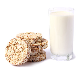 Glass of fresh milk with biscuit isolated on white background