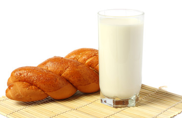 Glass of fresh milk with biscuit isolated on white background