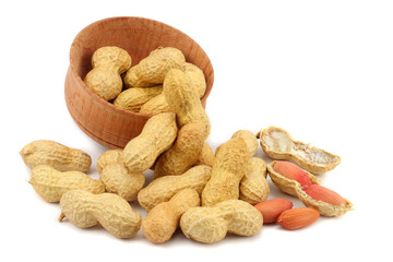 peanuts in wood plate isolated on the white background