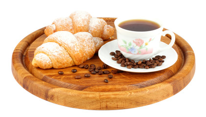 fresh croissant with coffee on wood background