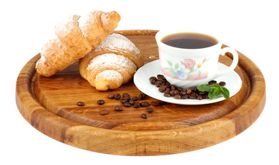 fresh croissant with coffee on wood background