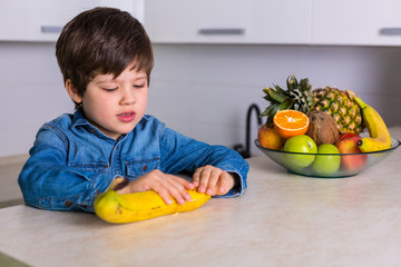 Little boy with a bowl of fresh fruits