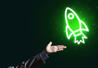 Man palm presenting Rocket web icon as technology concept