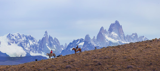 Gaucho riding against the background of Mount Fitz Roy, Patagonia, Argentina