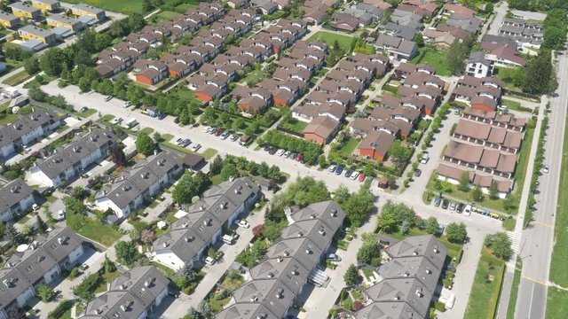 The views of the European modern village near an old town in a natural forested area, aerial, 4K - 4