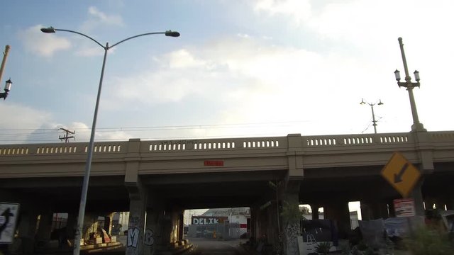 Driving Under A Bridge Panning Up With Clearance Sign
