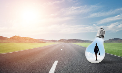 Businesswoman inside light bulb